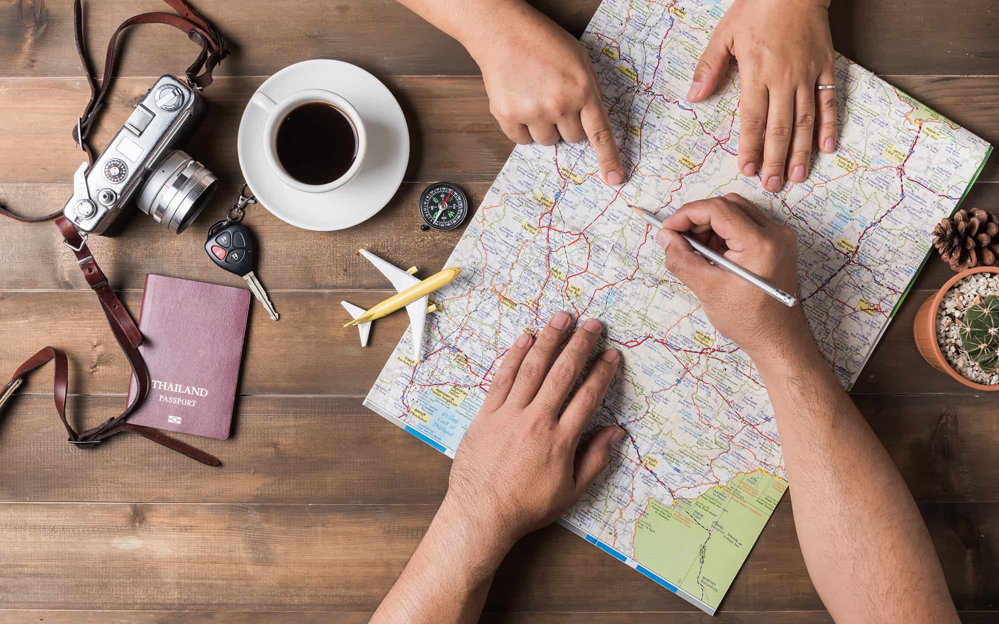 https://hobartwealth.com/wp-content/uploads/2023/02/Two-People-Looking-at-Map-Planning-Trip.jpg