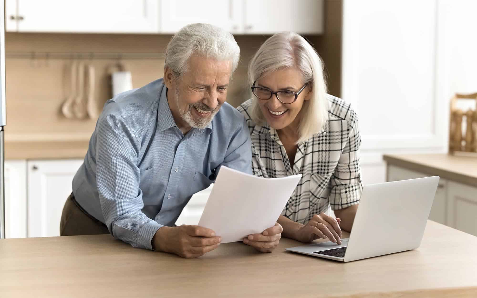 Long Term Financial Goals In 2024 Hobart Wealth   Side View Of A Happy Elderly Couple Looking At Laptop And Financial Document 